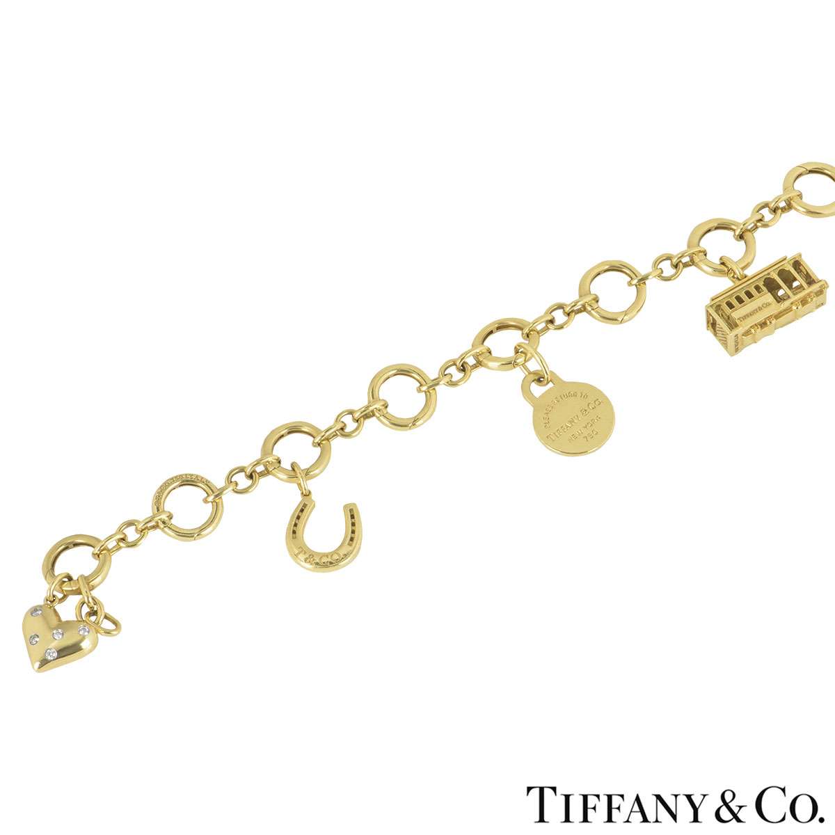 Tiffany and Co. Yellow Gold Charm Bracelet at 1stDibs  tiffany gold charms,  tiffany charm gold, tiffany charms gold